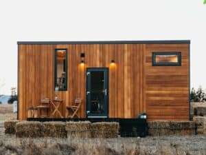 Exterior view of Tiny Getaway small house with inverted design amidst nature