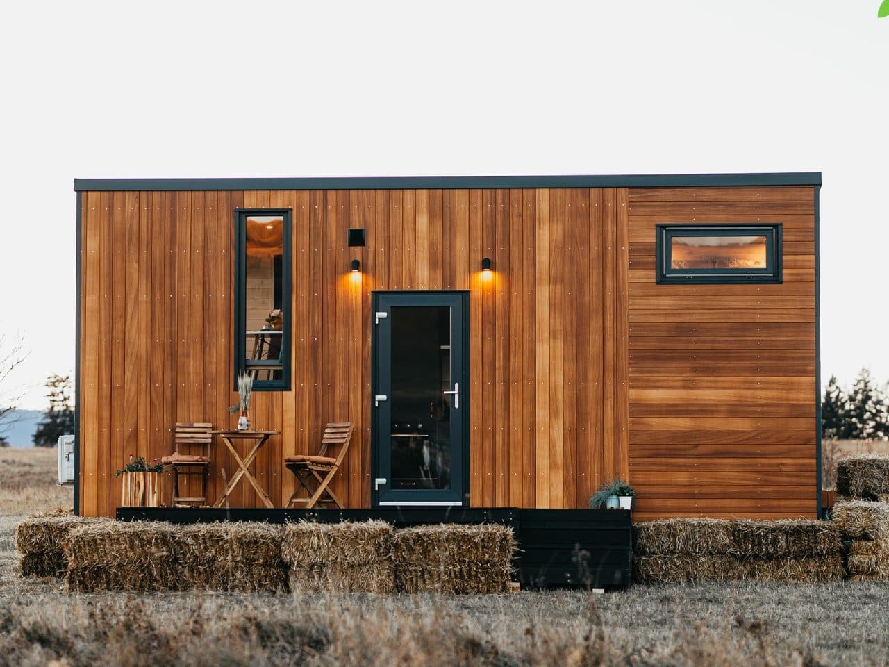 Exterior view of Tiny Getaway small house with inverted design amidst nature