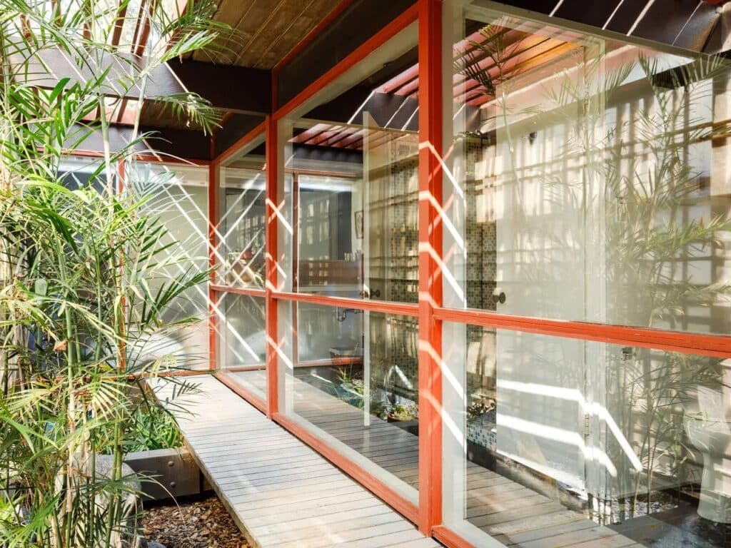 Norton House facade along a natural water stream