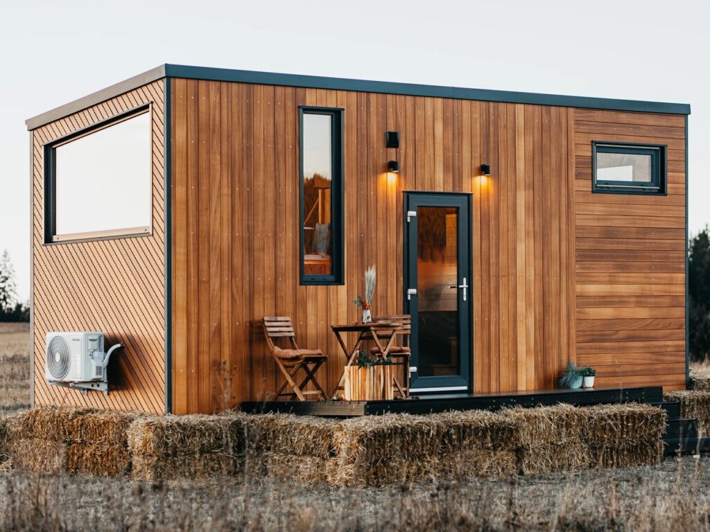 Exterior view of Tiny Getaway small house with inverted design amidst nature