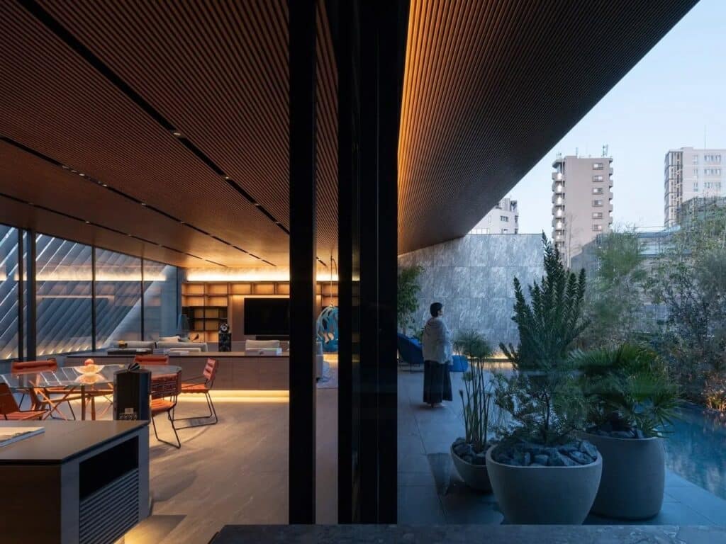 Exterior view of the Hidden House in Minato, Tokyo, showing a solid concrete facade.