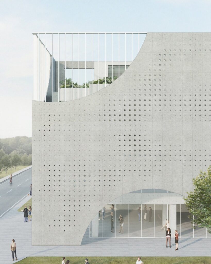 Circular openings in the building facade allowing natural light to enter.