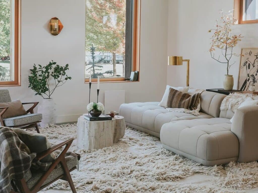 Bright interior space in Freya House with natural daylight and wooden-framed windows