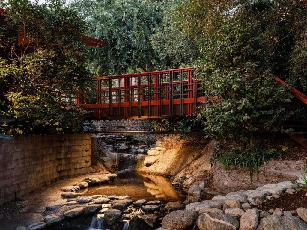 Norton House facade along a natural water stream