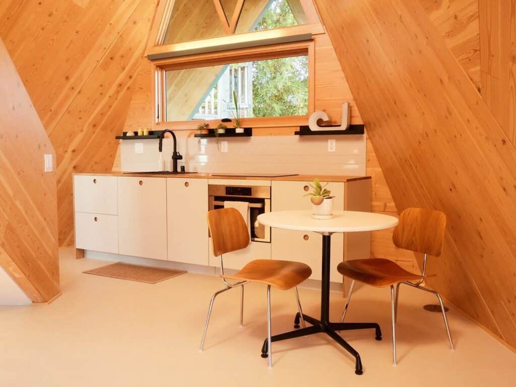 Tetra-One origami-inspired home exterior in La Jolla backyard, reflecting California sunlight