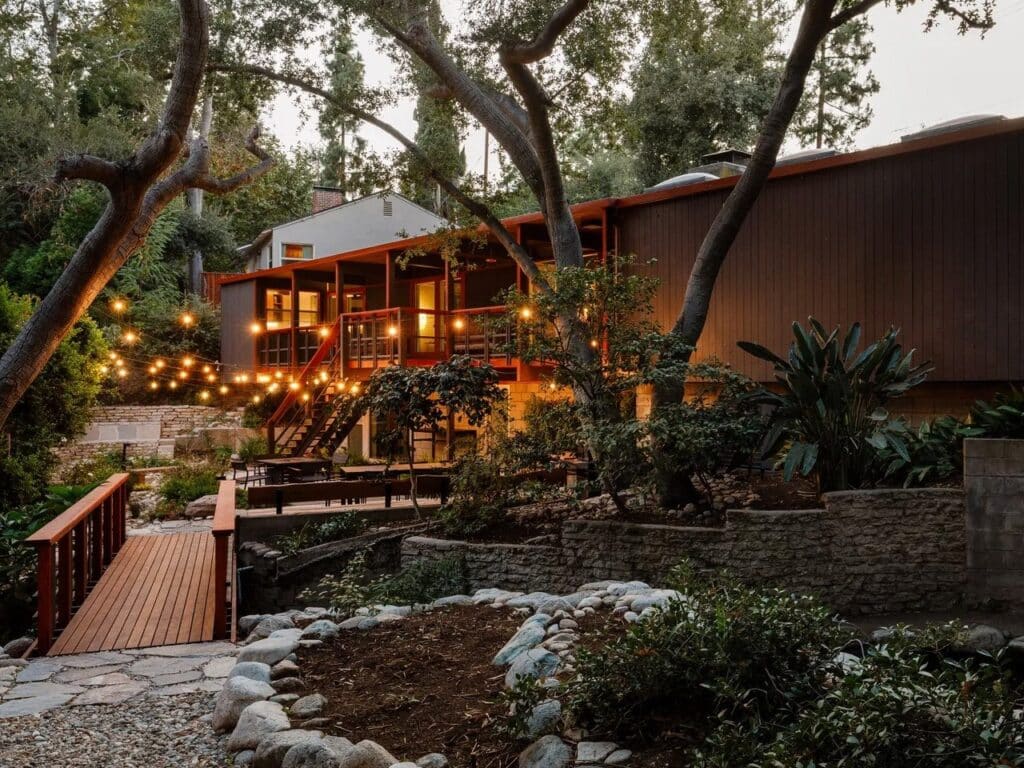 Norton House facade along a natural water stream