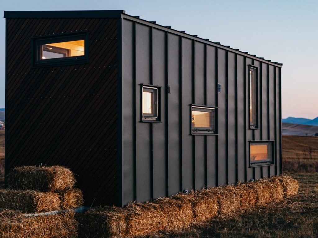 Exterior view of Tiny Getaway small house with inverted design amidst nature