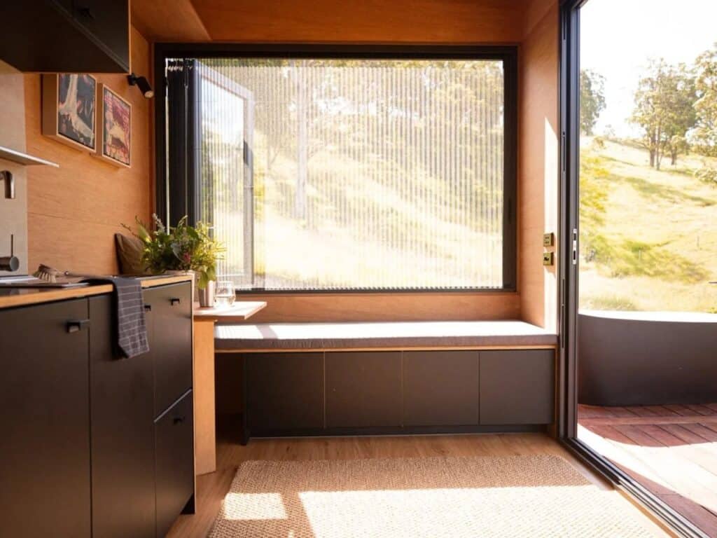 Functional kitchen in a small house with workspace and two-burner stove