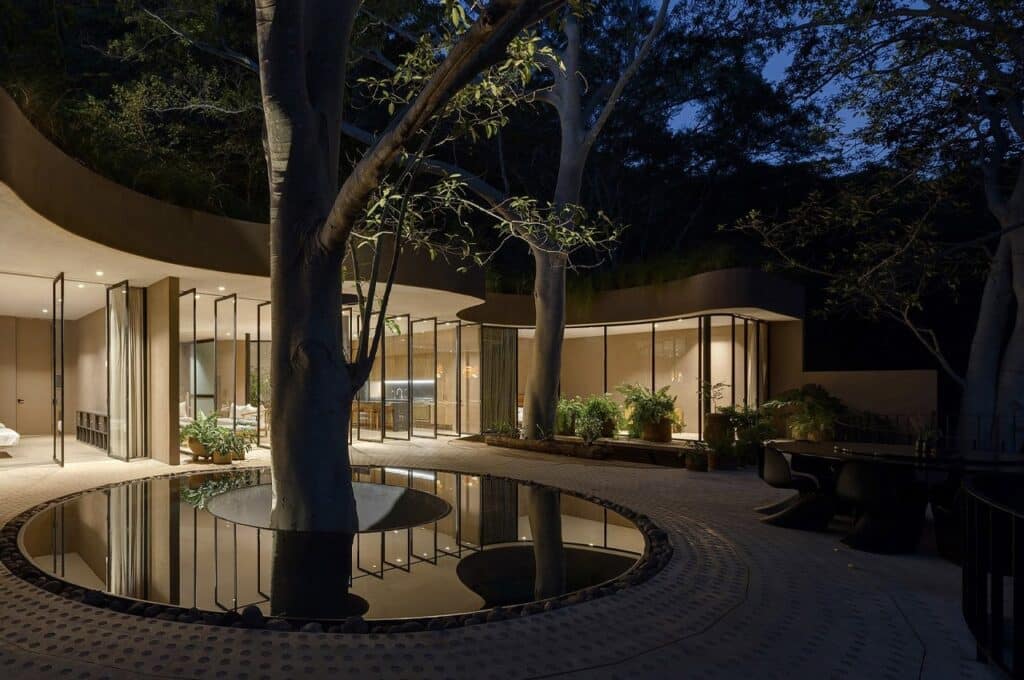 Casa Santa Maria del Oro architectural design on lakeside, blending modern architecture with natural surroundings