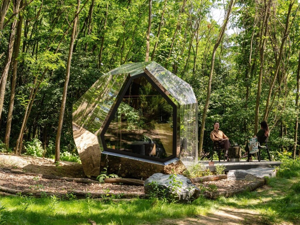 PEBL Grand multi-faceted cabin in a natural setting