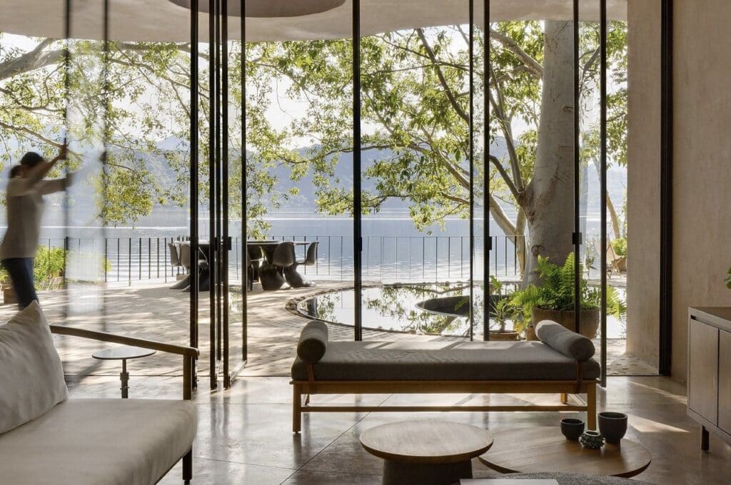 Casa Santa Maria del Oro architectural design on lakeside, blending modern architecture with natural surroundings