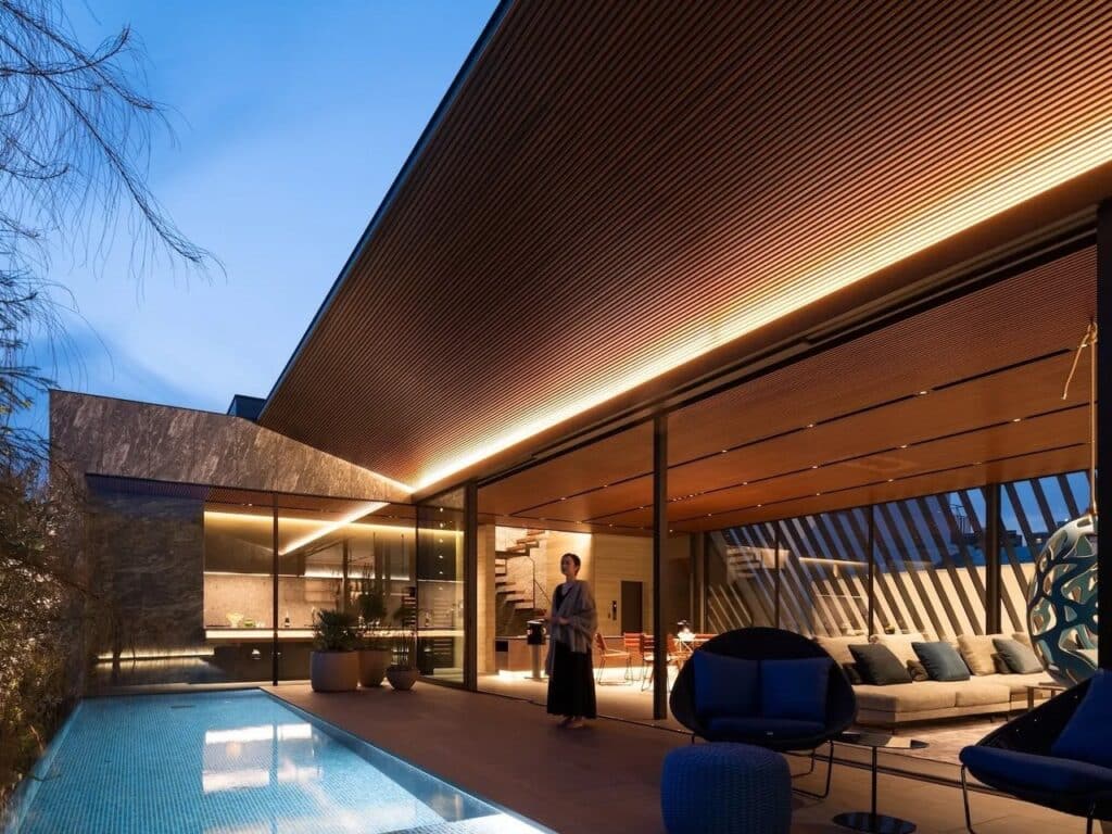 Architectural details highlighting the contrast between concrete exterior and wooden interior.