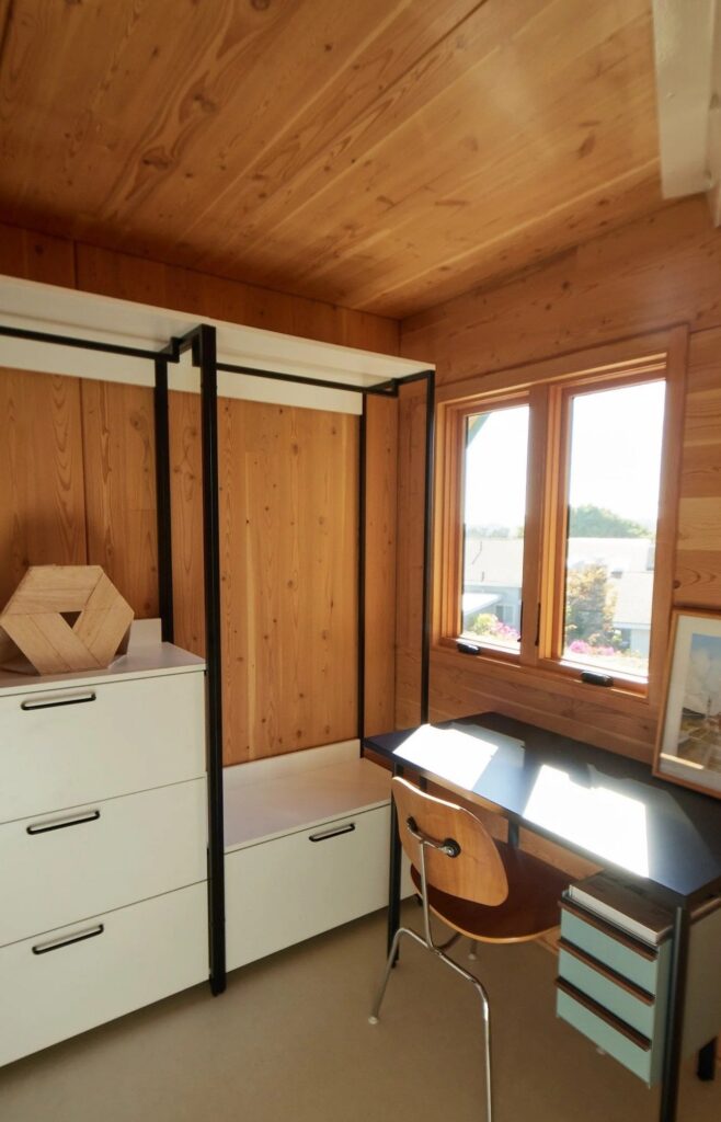 Tetra-One origami-inspired home exterior in La Jolla backyard, reflecting California sunlight