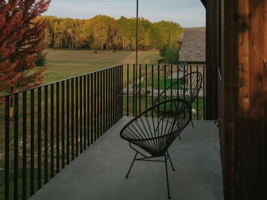 Side view of Freya House showing integration of Scandinavian design with surrounding nature