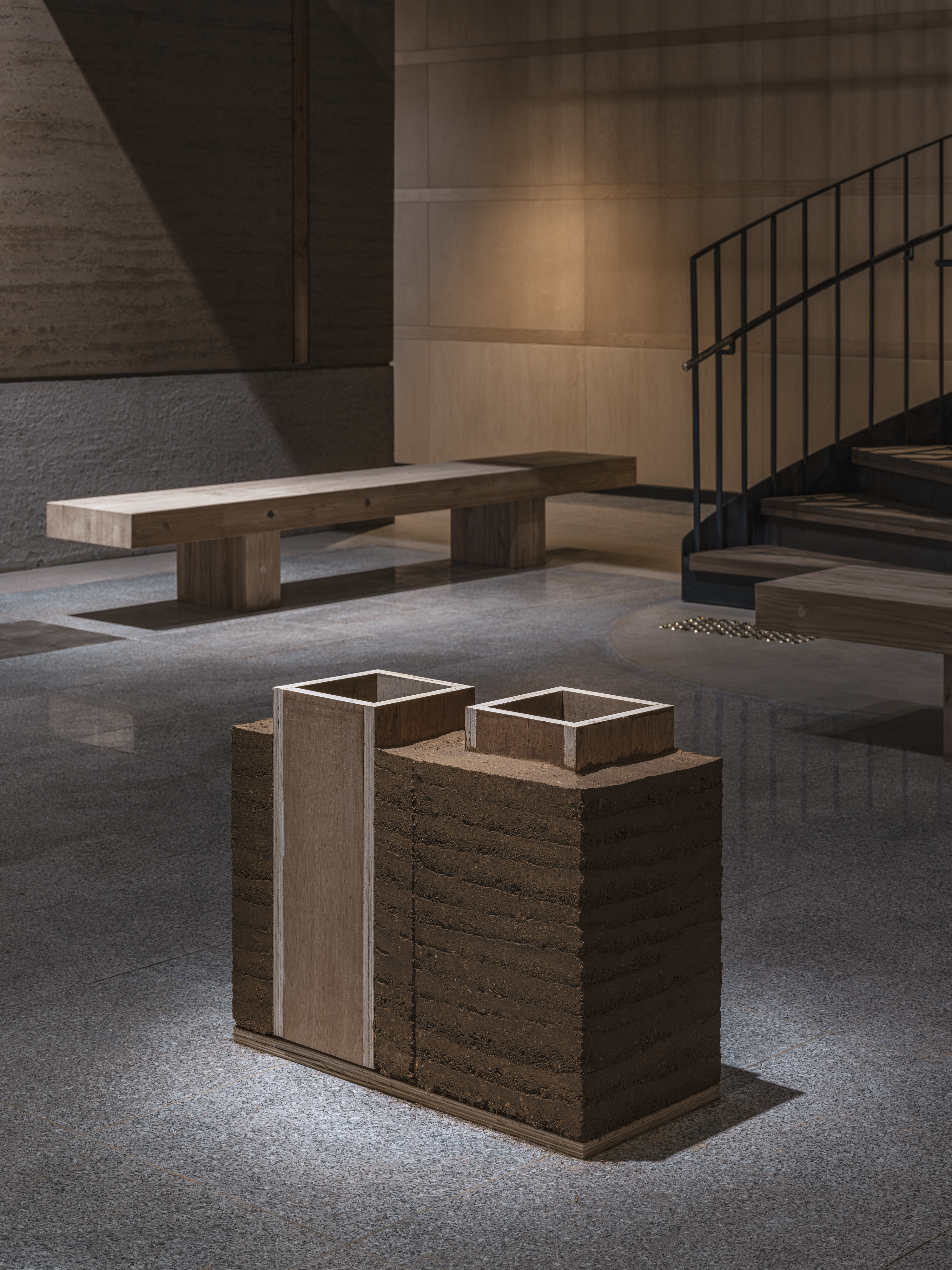 Bangjja Yugi Museum interiors featuring earth built walls and timber details