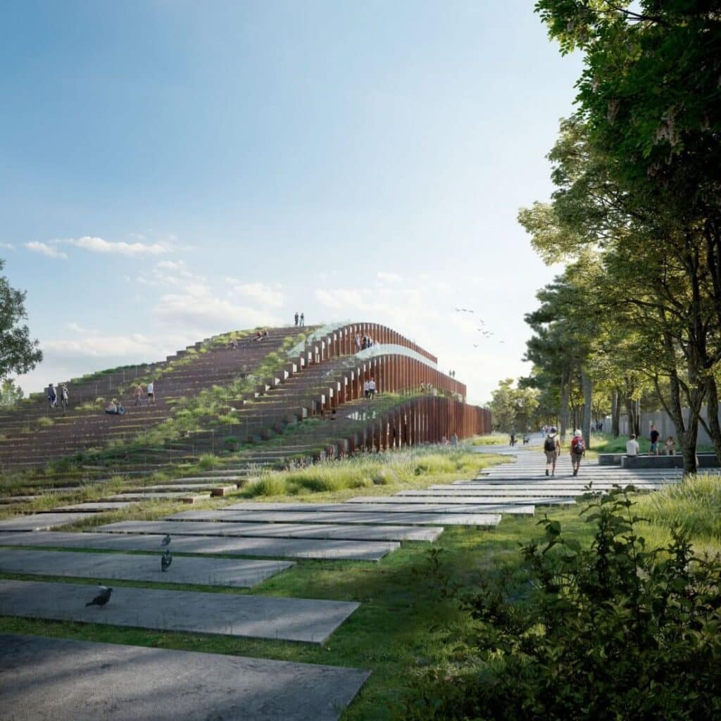 A spacious interior lobby with natural lighting and tiered stairs in a contemporary design.