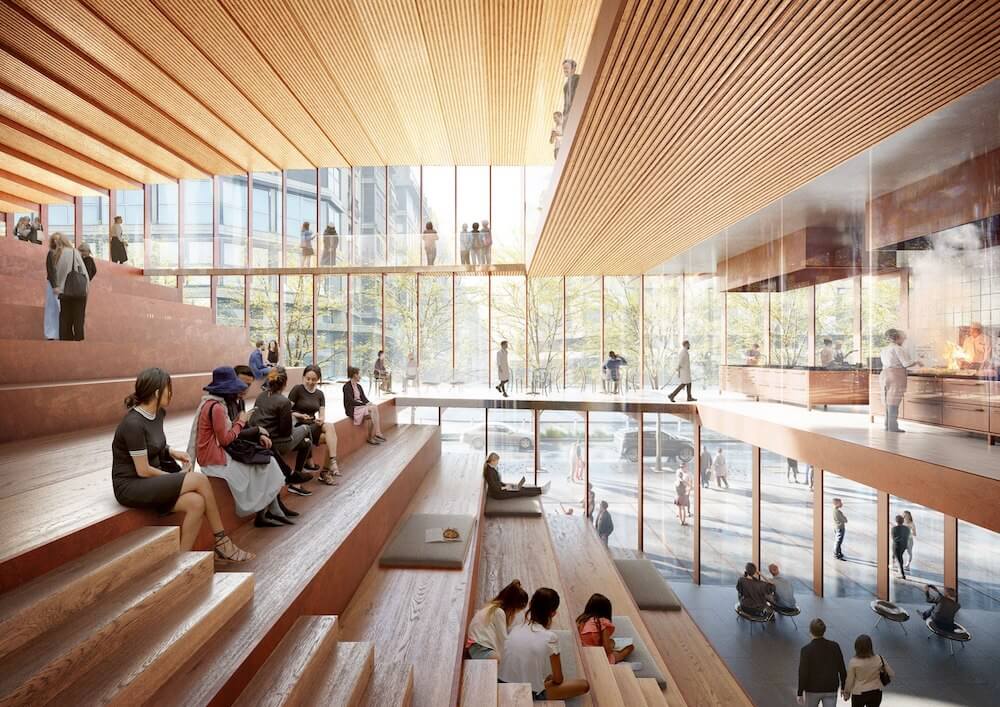 An outdoor plaza surrounded by greenery and pedestrian pathways in a calm urban design.