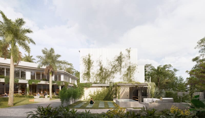 Solhaven common area: yoga, palms, water features, green walls.