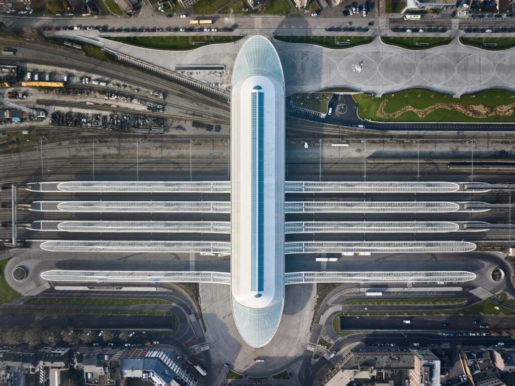 Glass bridge spanning over Mons train station, seen from above