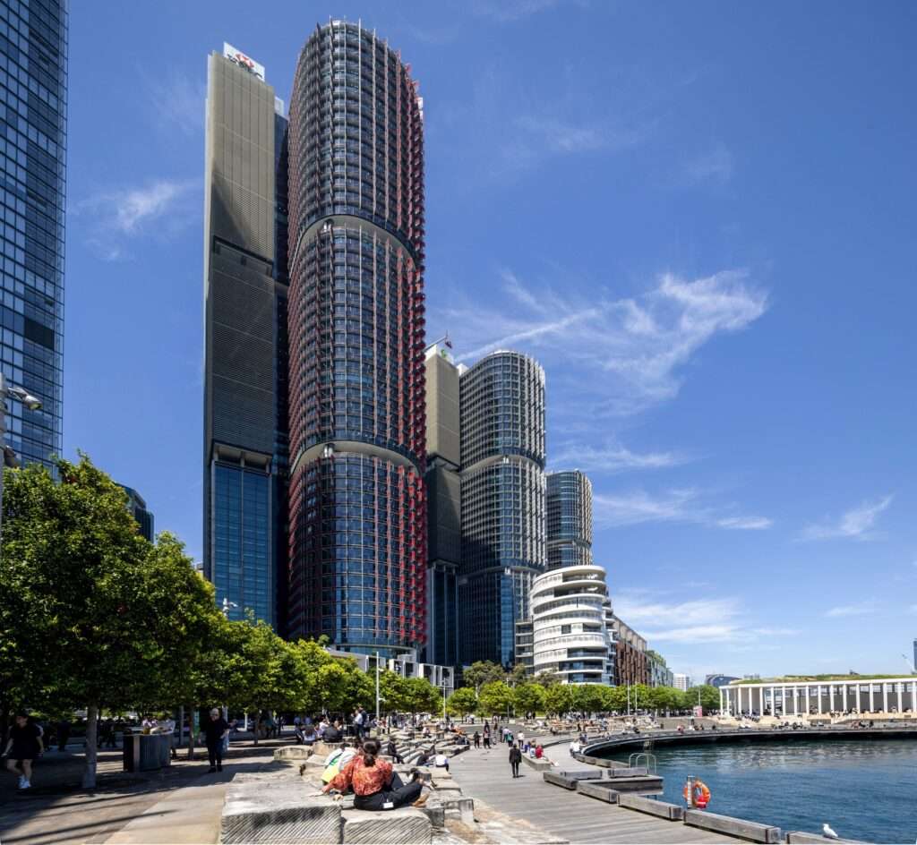 Barangaroo South: modern towers meet harbourfront life under blue skies.