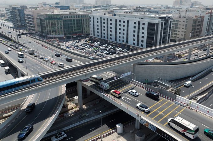 A newly opened 300-meter bridge on Sheikh Zayed Road, connecting major roadways and easing access to shopping centers, with smooth traffic flow and integrated infrastructure including pedestrian walkways and cycling paths.
