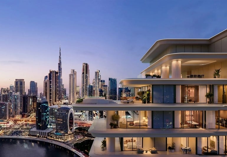 Facade of the wellness tower in Dubai with Burj Khalifa in the background, highlighting the blend of modern design and urban skyline.