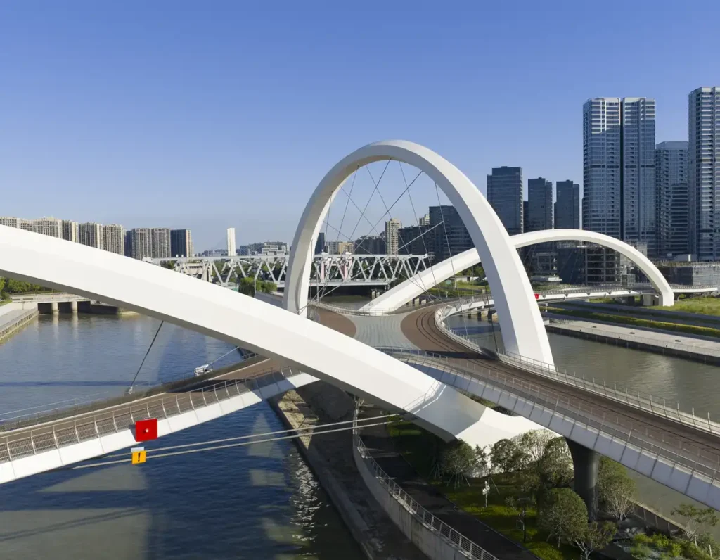 Grand Canal Gateway Bridge in Hangzhou — a fluid white structure weaving across the water, blending engineering with urban heritage.