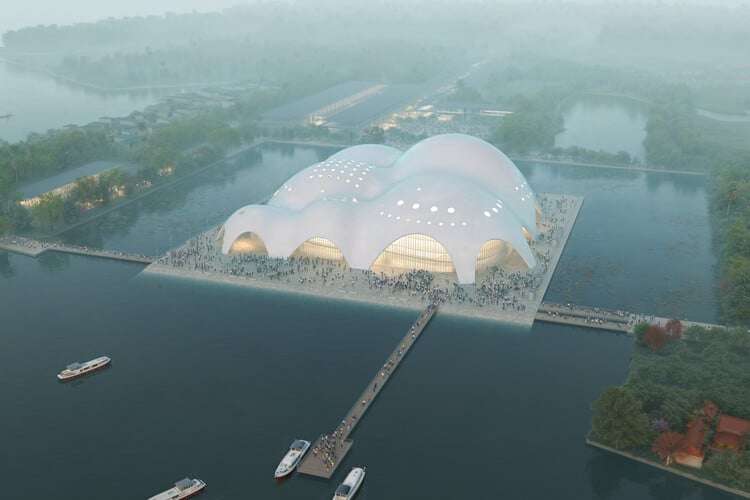 The new Hanoi Opera Hall with curved concrete forms rising above the lake and reflecting natural light.
