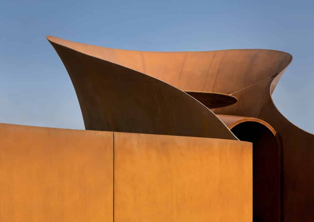 Glass facade of a smart building reflecting sunlight within the sustainable district