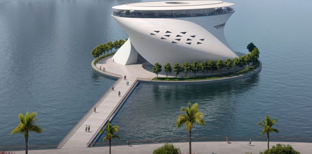 Panoramic view of the Dubai Museum of Art showing the building’s smooth curves and circular platform over the water.
