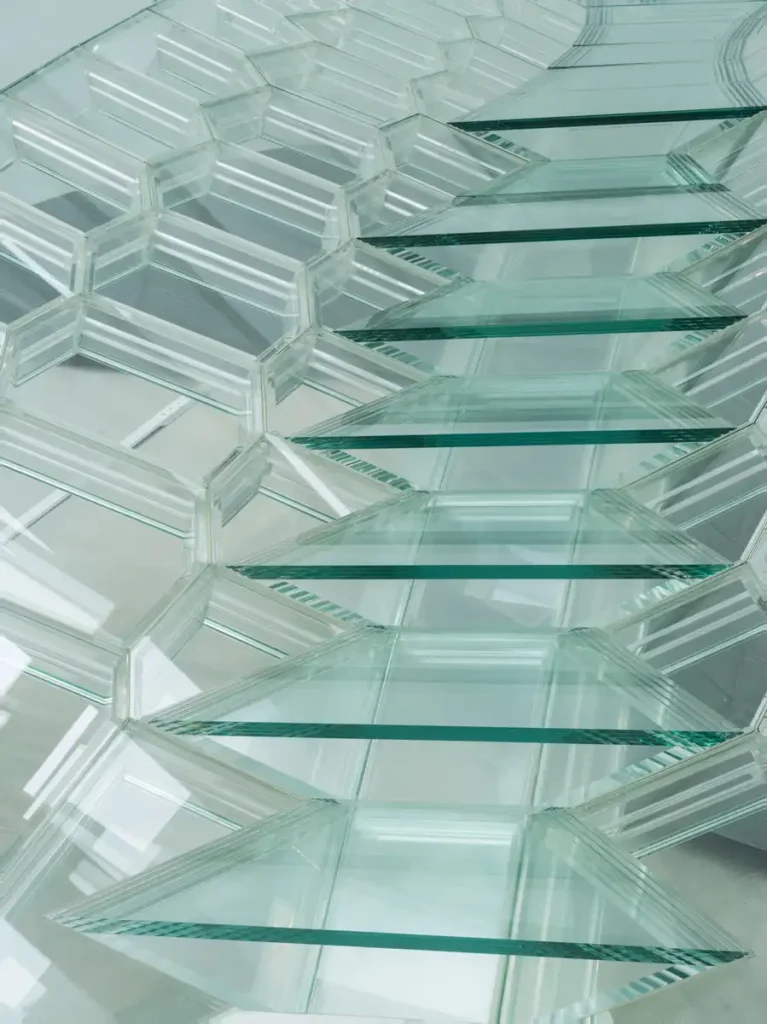 Detail of hollow 16-mm thick glass modules and connectors in the bridge