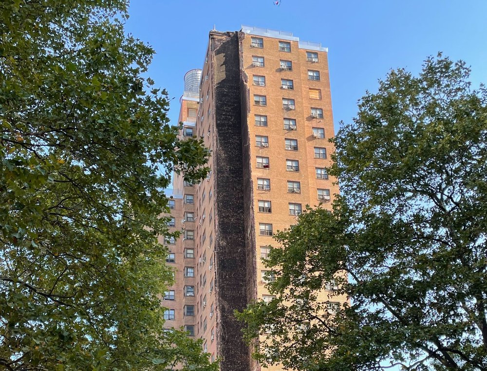 Firefighters responding at the Bronx building explosion site