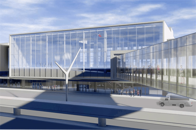 LAX Terminal 5&rsquo;s glass fa&ccedil;ade glowing in daylight, with travelers and a service van outside.