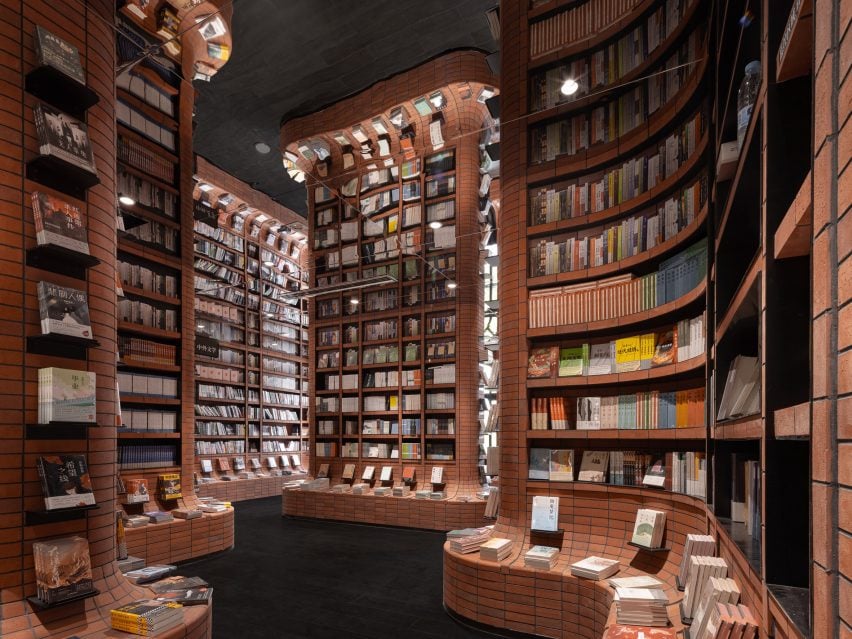 Curved brick shelves filled with books at Zhongshuge &mdash; warm, inviting, and full of stories.