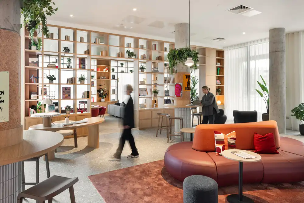 Communal areas at Liberties House combine wood and exposed concrete to create a balanced social environment.