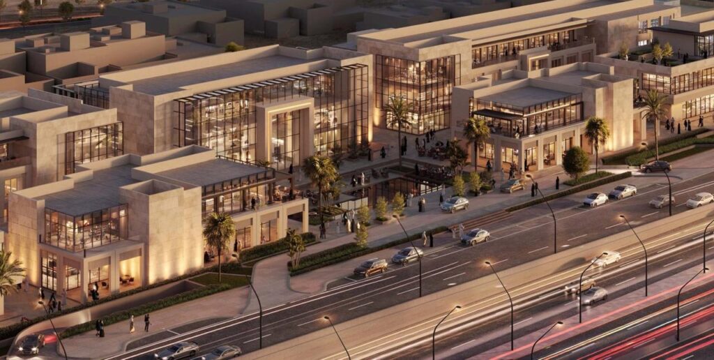 An aerial evening view of Zone 3 in North Riyadh &mdash; a modern commercial district with glass-fronted buildings glowing warmly, palm trees lining walkways, cars zipping by on busy streets, and people strolling outside under soft lighting.