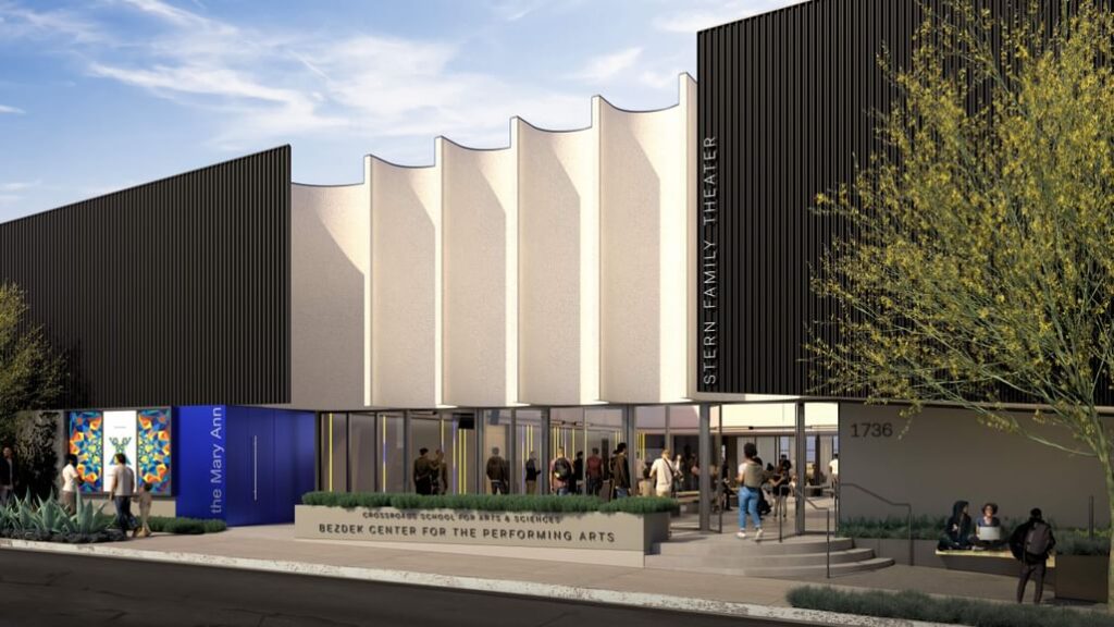 Exterior rendering of the Bezdek Center for the Performing Arts, featuring a modern facade with wavy white panels, black vertical cladding, and a bustling entrance where people gather. The building&rsquo;s name and &ldquo;Stern Family Theater&rdquo; are visible on the walls.