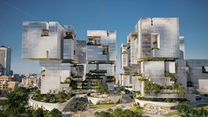 مشهد شامل لمشروع ماياسِم، يُظهر مبانيه المعلقة والمتدرجة مع حدائق خضراء، محاطة بمساحات عامة وسط مدينة جدة.