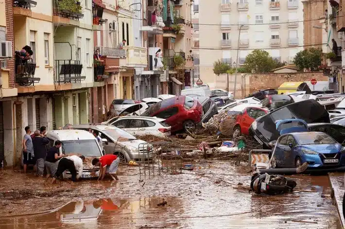 Public plaza filled with rainwater and large puddles