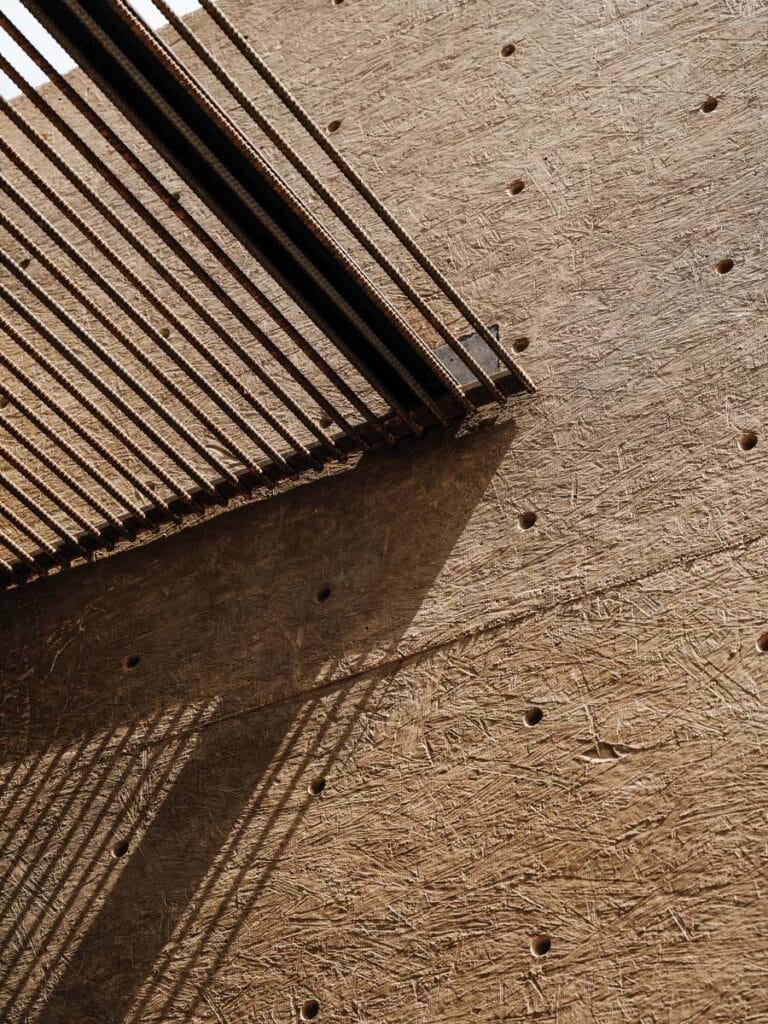 Close-up of the oxidized metal façade of the Cocopah Museum highlighting light interaction throughout the day.
