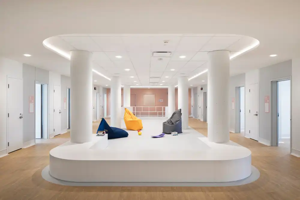 Cozy lounge area at CRJDA Sainte-Thérèse with bean bags, soft lighting, and open space.