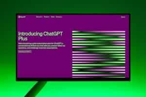 Close-up of a monitor displaying ChatGPT Plus introduction on a green background.