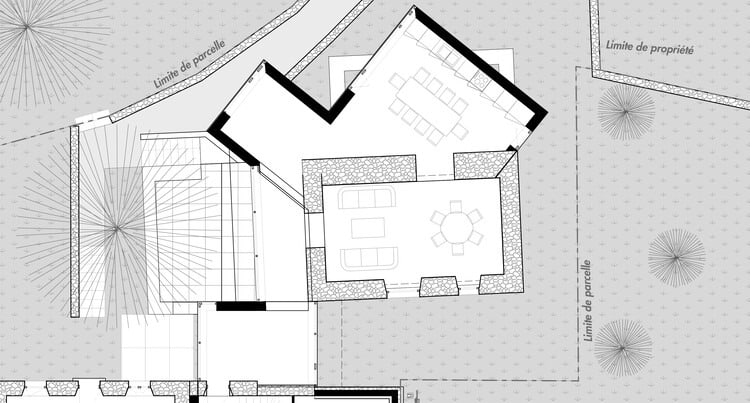 Exterior view of Clos Saint-Martin project blending historical stone buildings with modern wooden extensions and landscaped terraces.