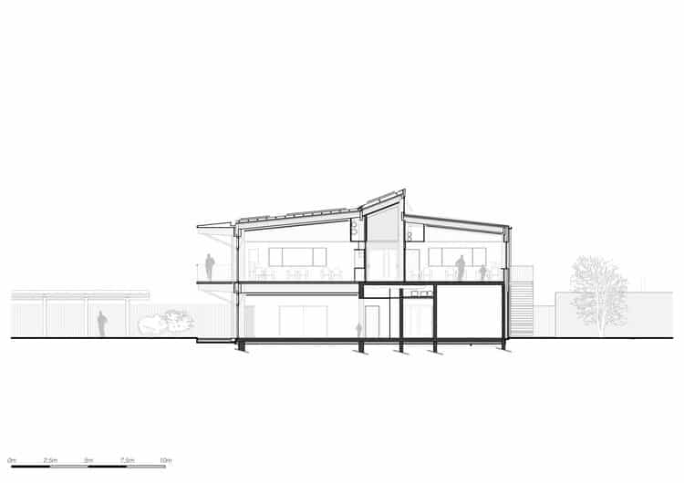 Facade of Jules Verne School complex with main entrance and front courtyard