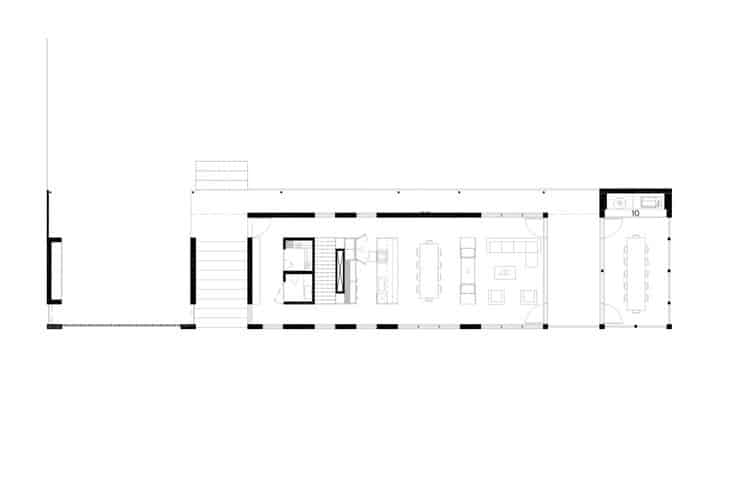 Residential building in Laurentians integrated with surrounding nature and interior spaces.