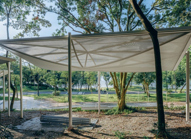 Semi-transparent floating pavilions within the local forest