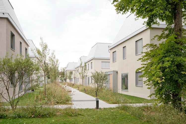 Overall view of Neubiberg residential quarter showing terraced buildings and green spaces