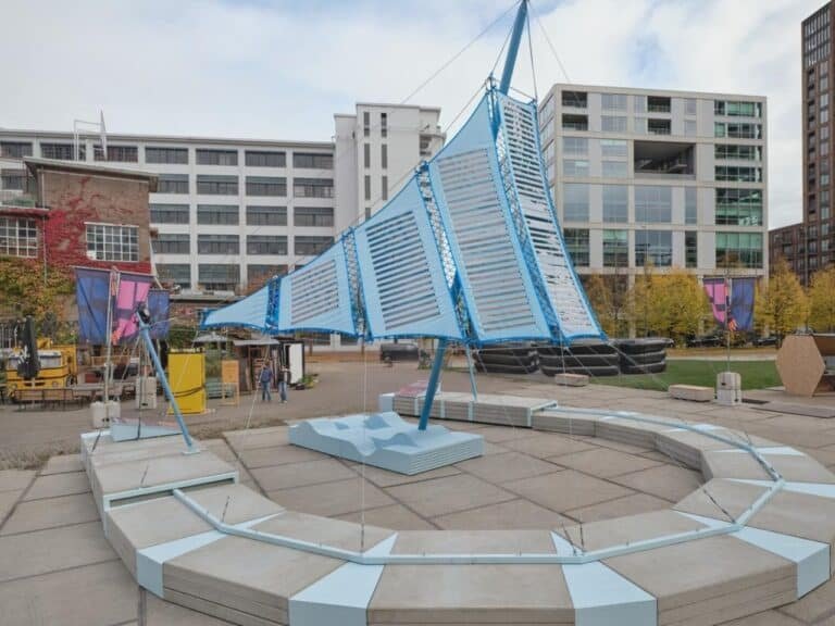 Umbra Pavilion facade with sky-blue roof and Heliotex solar materials