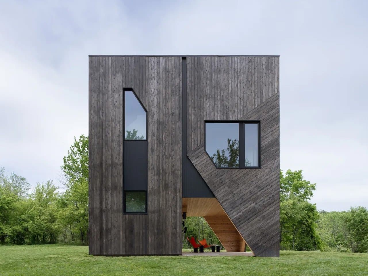 House on the Hill in Hudson Valley covered with cedar wood amidst the forest
