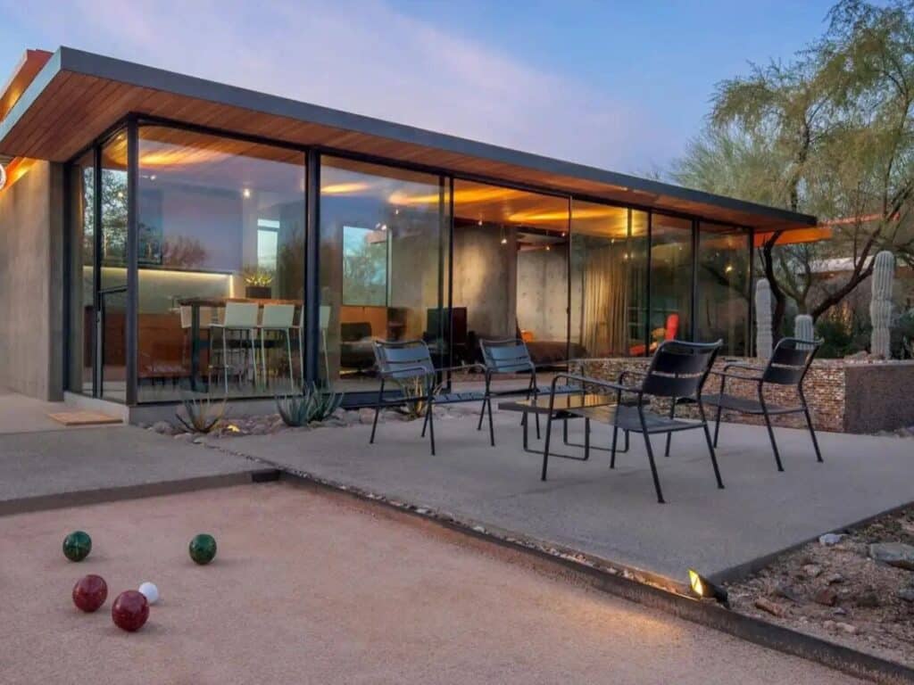 Renovated guest house in the Phoenix desert, blending heritage and modern architecture with minimalist interiors, natural materials, and landscaped outdoor spaces.